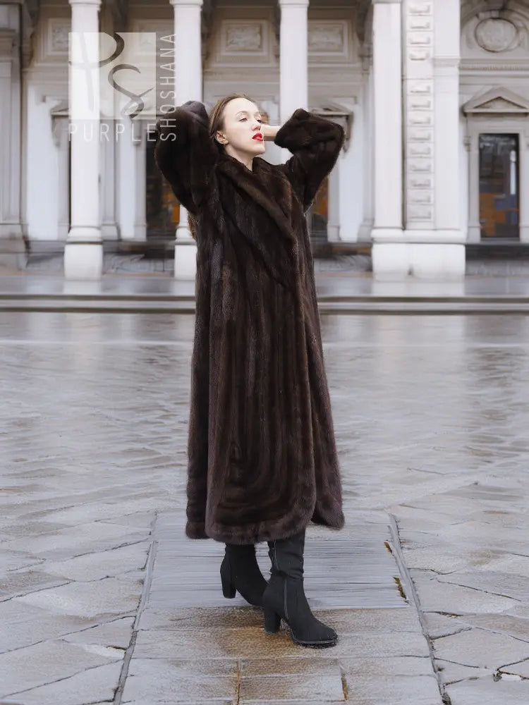 Long dark brown mink fur coat with wide collar and full sleeves, front view