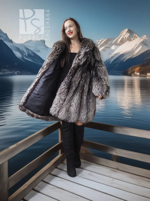 Silver fox fur coat in dark silver-gray, long loose fit with soft, shaggy texture.