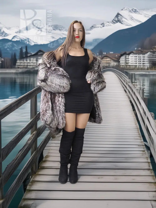 Silver fox fur coat in dark silver-gray with wide fur cuffs and open, draped front.