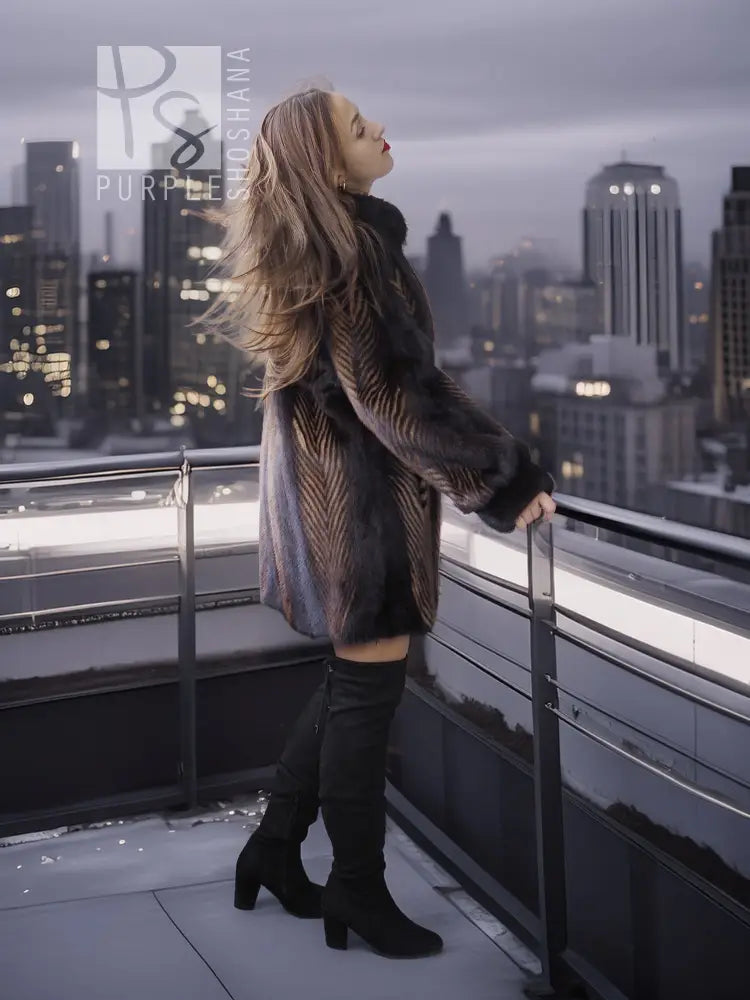 Women's two-tone mink jacket with long sleeves, dark fur and tan herringbone accents on front.