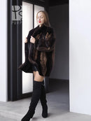 Women's two-tone mink jacket with herringbone pattern panels, dark sleeves and tan accents.