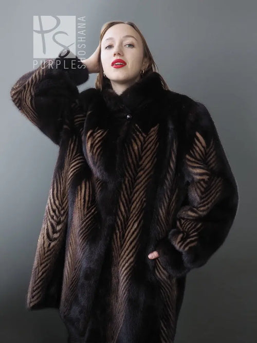 Two-tone mink jacket with herringbone pattern and high collar, close-up front