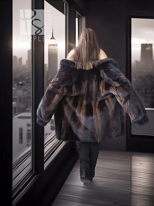 Two-tone mink jacket seen from back, herringbone pattern, long sleeves and collar.