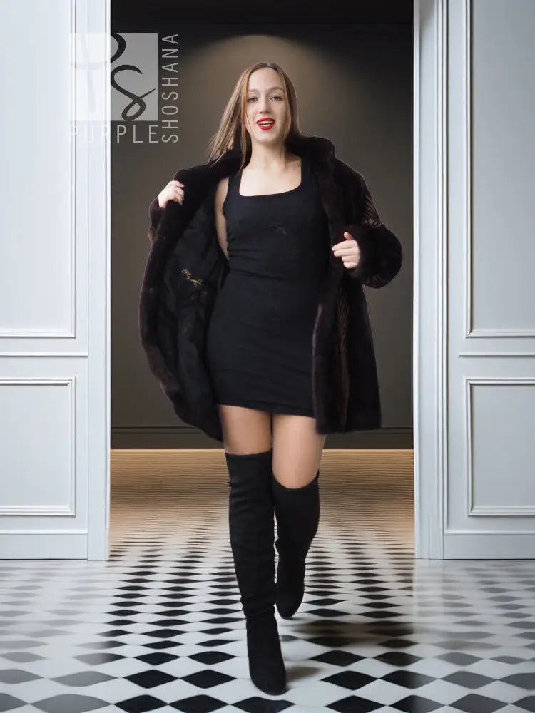 Women's two-tone mink jacket with open front, dark fur and tan herringbone paneling.