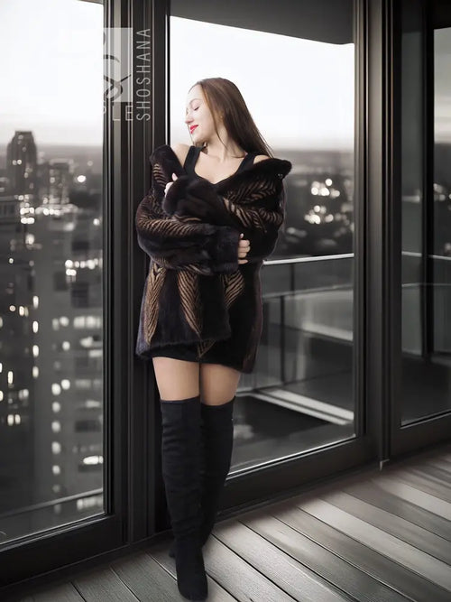 Two-tone mink jacket with herringbone pattern, dark stand collar, long sleeves.