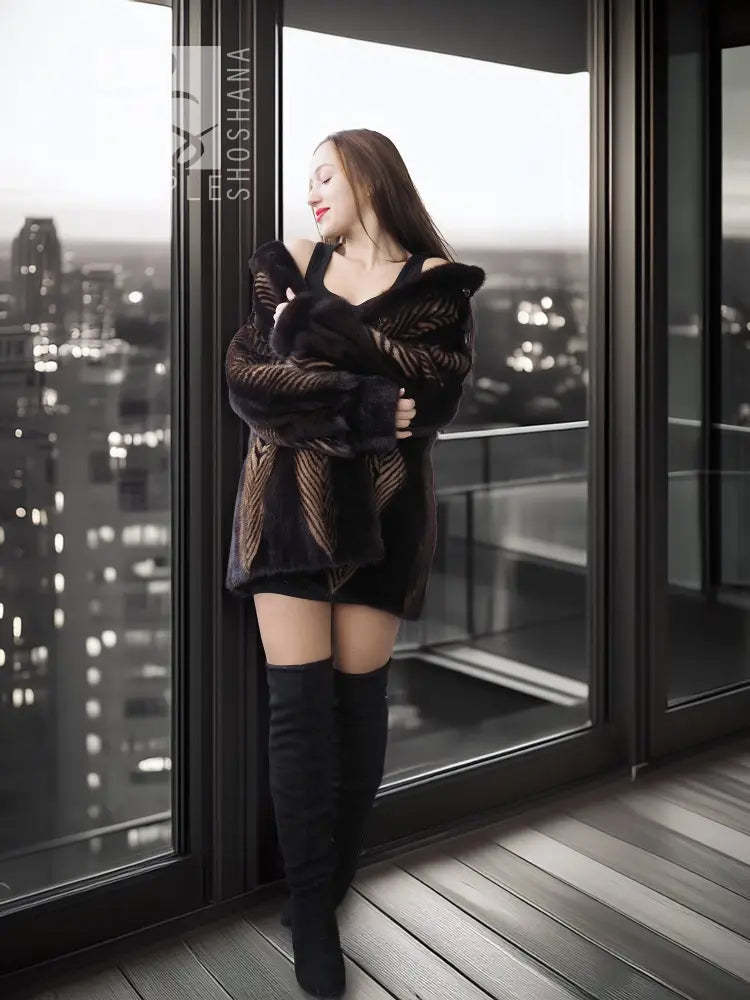 Two-tone mink jacket with herringbone pattern, dark stand collar, long sleeves.