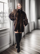 Two-tone mink jacket with herringbone pattern, dark collar, long sleeves, side front.