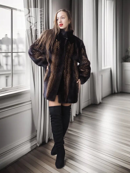 Two-tone mink jacket with herringbone pattern, dark collar, long sleeves, side front.