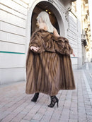 Brown mink fur coat with draped collar and full length silhouette