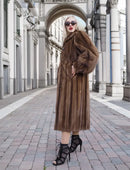 Brown fur mink coat with high collar, button front, and long sleeves