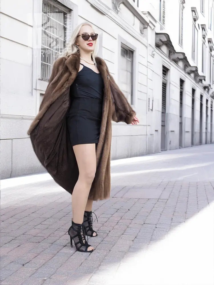 Dark brown mink fur coat with hood, long sleeves, and relaxed swing silhouette