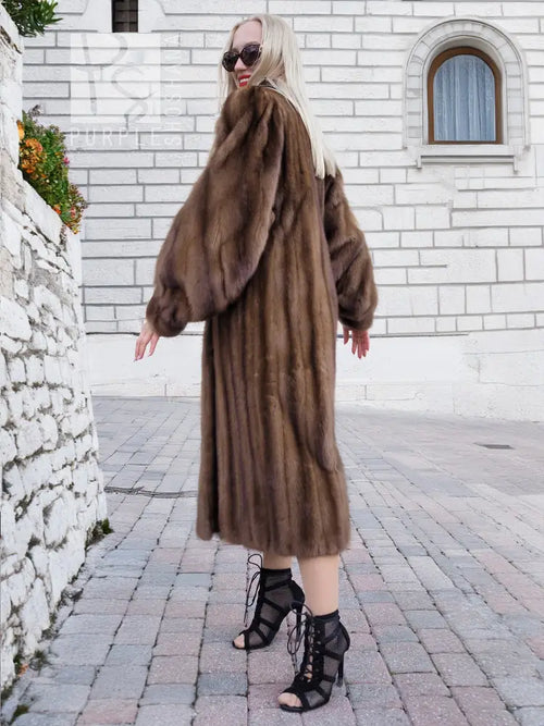 Brown mink fur coat, long length with wide collar in side view