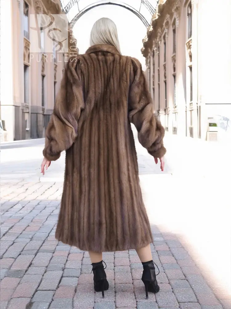 Back view of dark brown mink fur coat with hood and long flared hem
