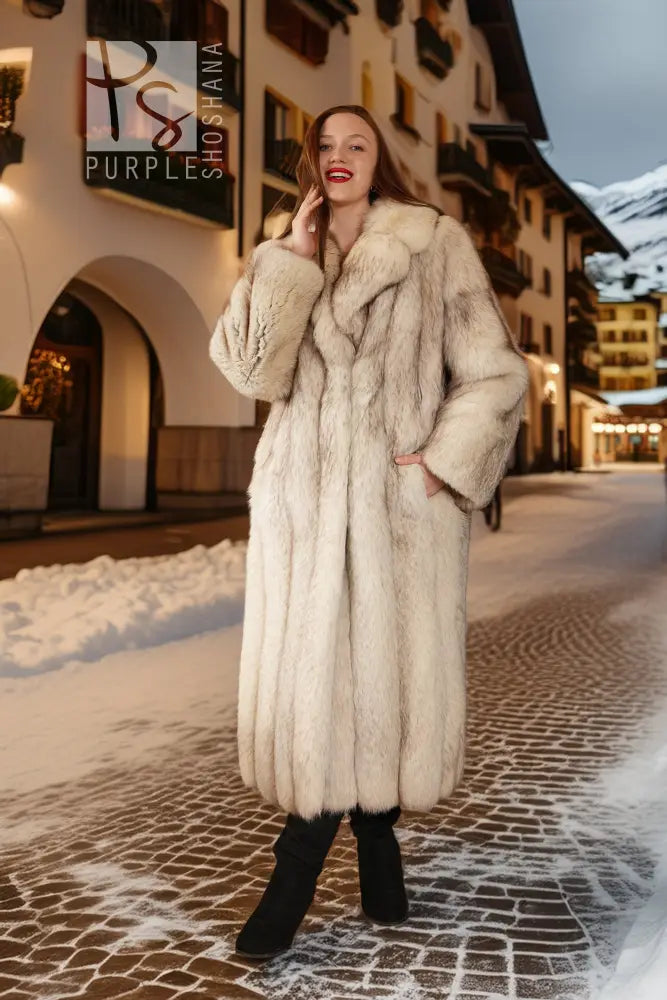 Cream faux-fur full-length coat with notched collar and long sleeves, front view.