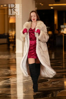 Cream faux-fur full-length coat with notched collar, open front, long sleeves.