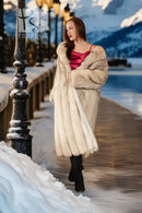 Plush full-length fur coat with notch collar, cream tone, long sleeves (front view)