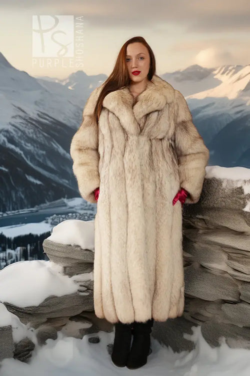 Cream plush fox fur full-length coat with notch collar, front view outdoors in snow