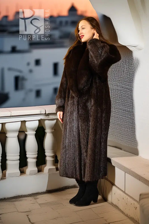 Beaver fur coat in a long length, shown in profile with fox collar and wide sleeves