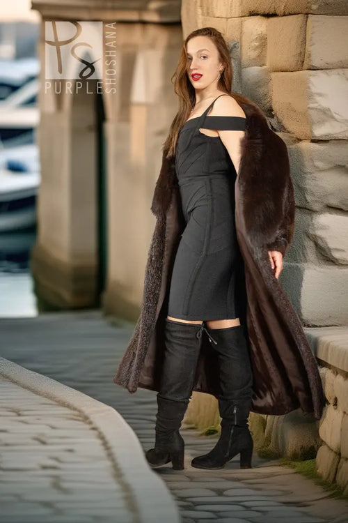 Beaver fur coat over dark fitted dress, open front with fox collar and long sleeves