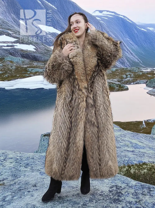 Long tan raccoon fur coat with shawl collar, front view, plush textured fur surface.