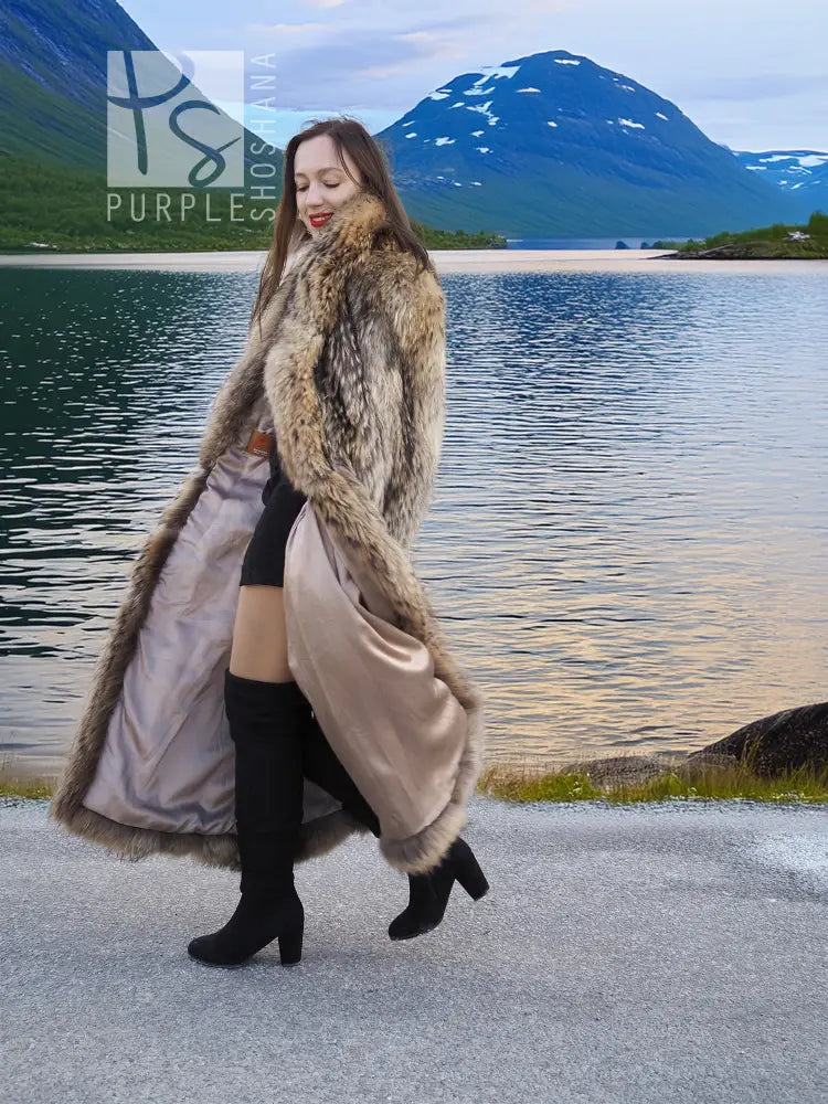 Long raccoon fur coat with shawl collar, side view, open front and flowing fur trim.