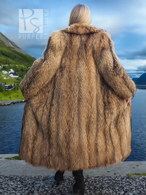 Back view of hooded raccoon fur coat in tan-brown, full sleeves and flared hem