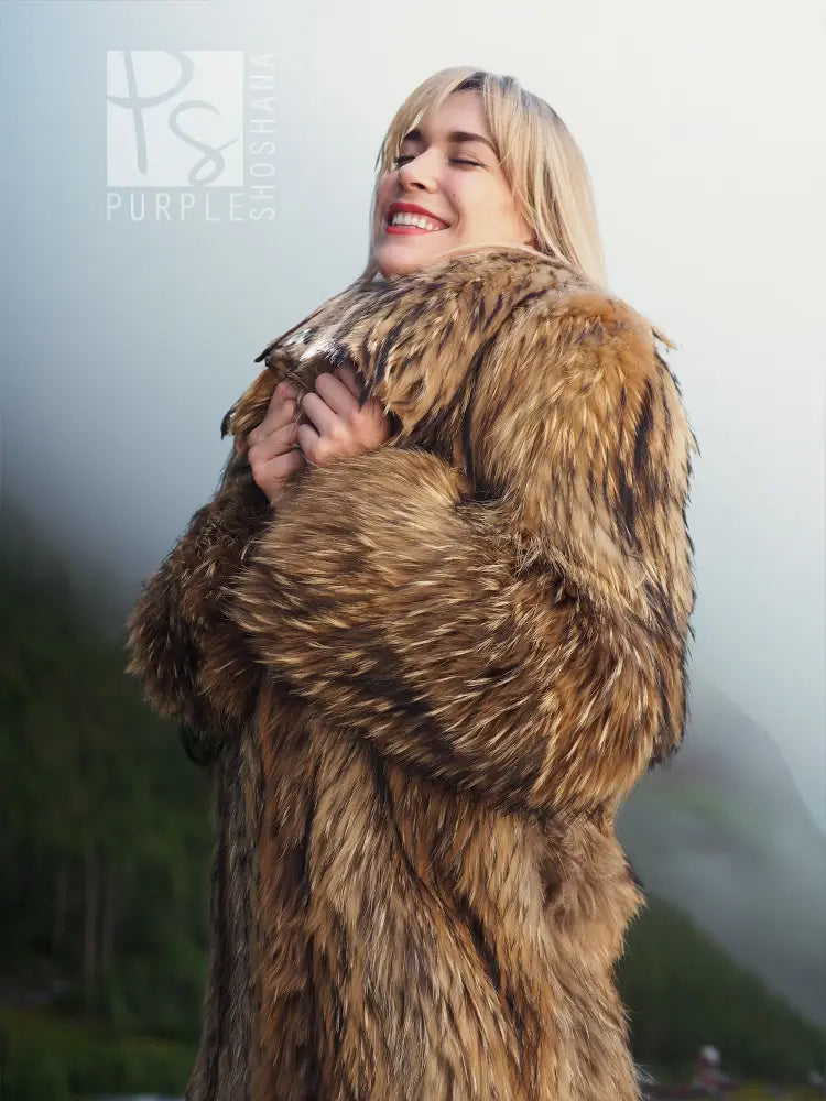 Brown raccoon fur coat with large hood and plush shawl-like shoulder wrap