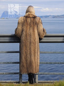 Back view of long brown raccoon fur coat with hood and relaxed sleeves