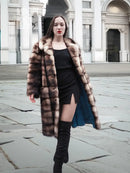 Long faux fur coat with front buttons and dark brown/cream horizontal blocks
