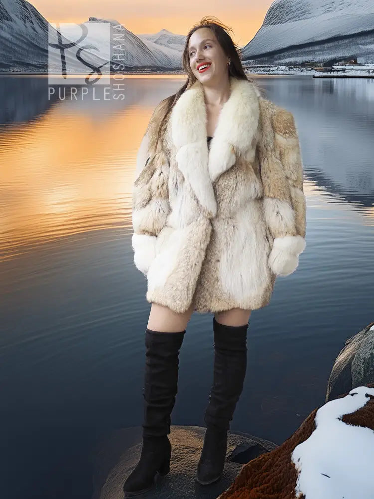 Cream fur jacket with tan trim, open front and long sleeves, knee-length