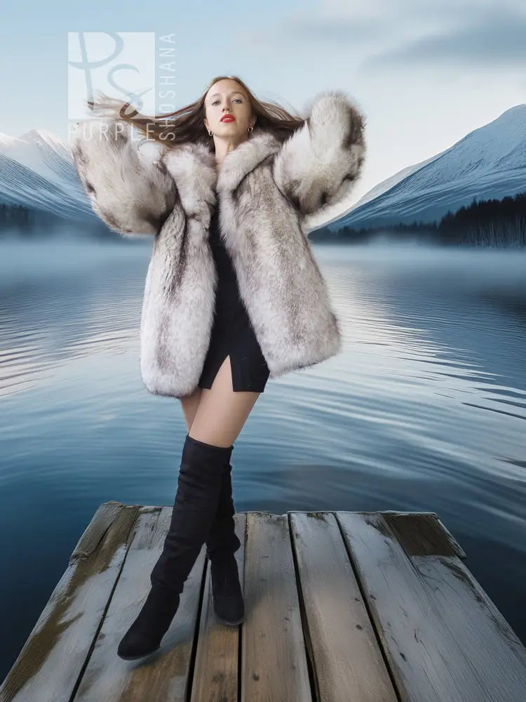 Light gray fur coat with wide sculptural collar, open front over black mini dress