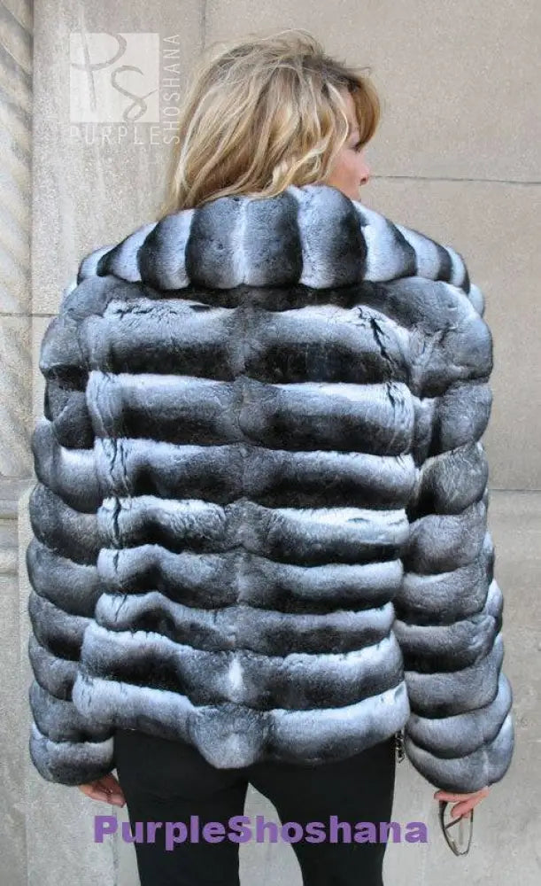 Back view of dark gray hooded fur jacket with wide horizontal stripes