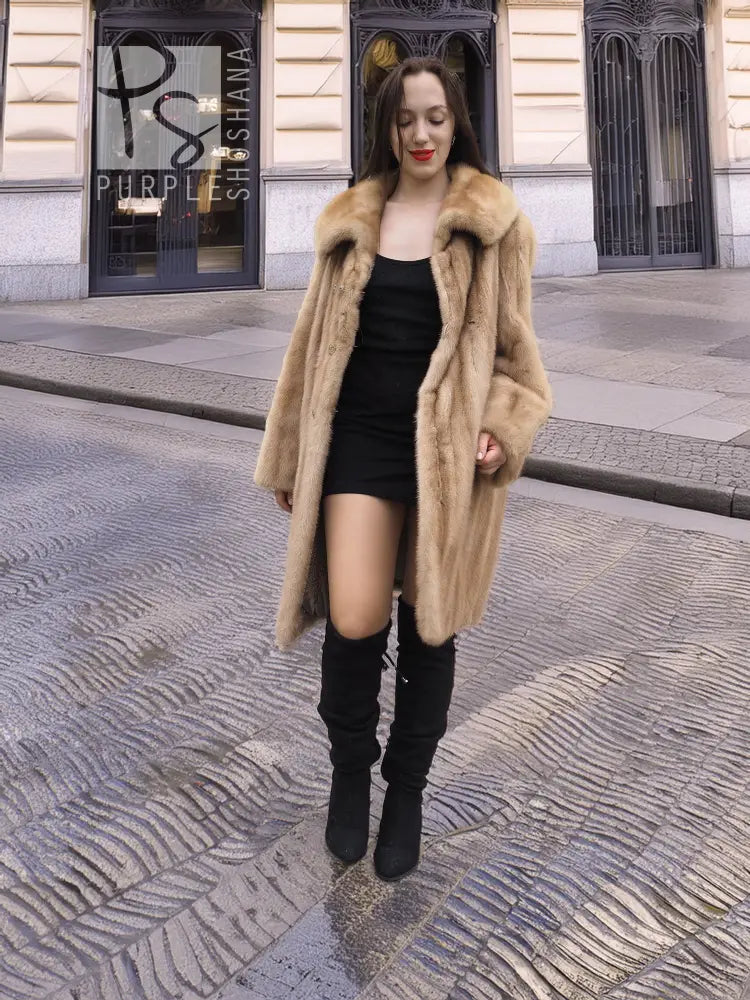 Beige mink fur coat with open front and wide lapels