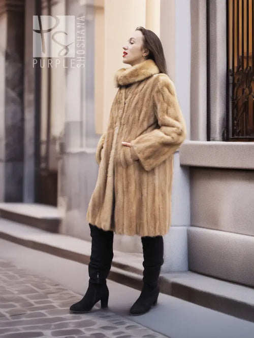 Beige mink fur coat from the side, stand collar and long sleeves visible.