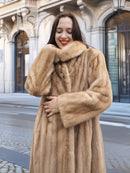 Beige mink fur coat with pointed collar and button-front, long sleeves.