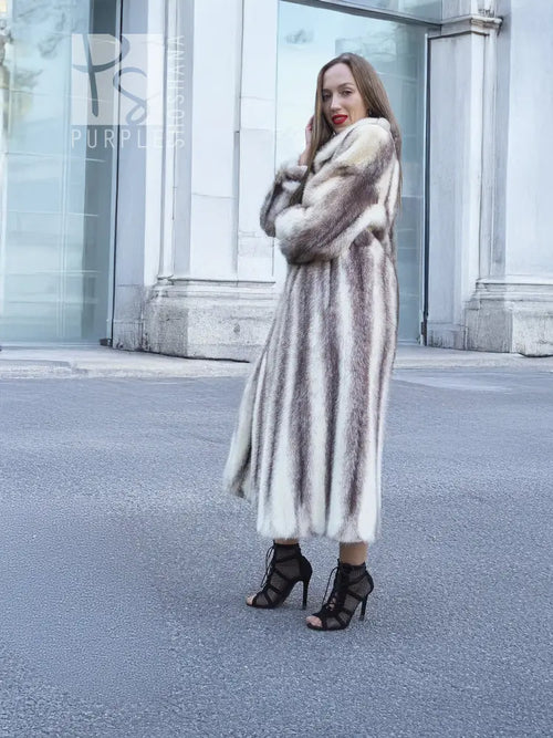 Hooded mink fur coat in a full-length side pose, open front and flared hem