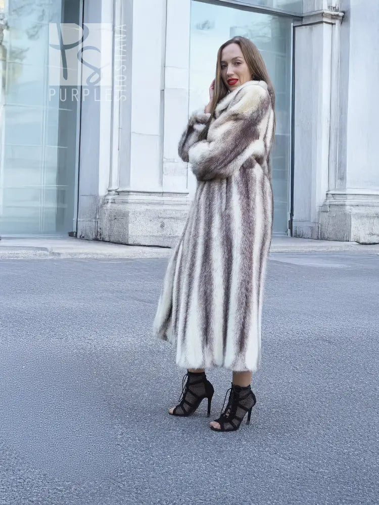 Hooded mink fur coat in a full-length side pose, open front and flared hem