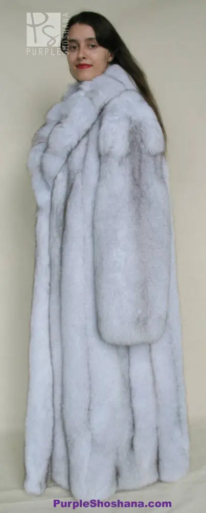 Light blue fox fur coat with full sleeves and high collar, side profile view