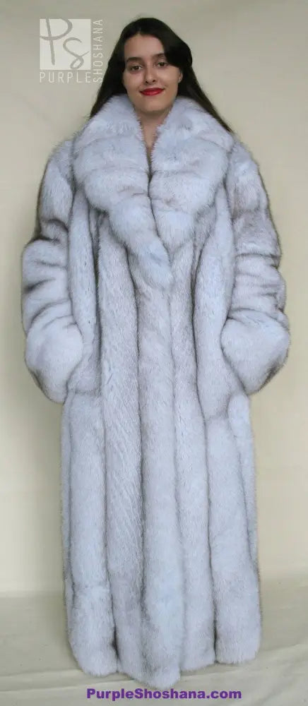 Light blue fox fur coat with high collar and front button-style closure