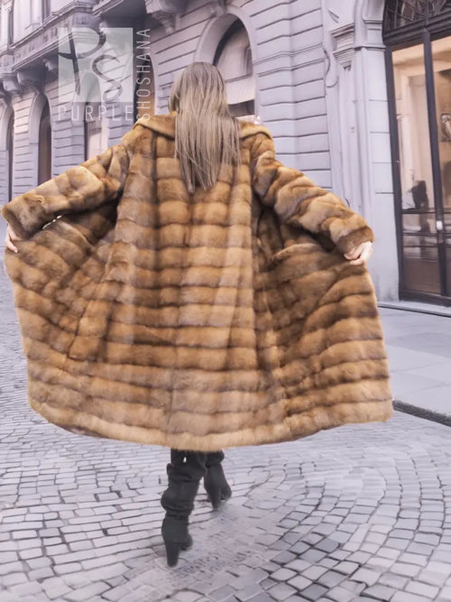 Back view: Beige pastel mink coat with shawl collar, horizontal stripes, long sleeves