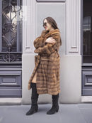 Beige mink fur coat with shawl collar, horizontal panels, front 3/4 view