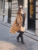 Beige pastel mink coat with shawl collar and horizontal stripes, open front, long sleeves