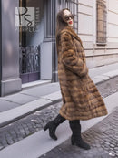 Beige mink fur coat with shawl collar, horizontal panels, side profile