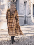Beige mink fur coat with shawl collar, horizontal panels, back view