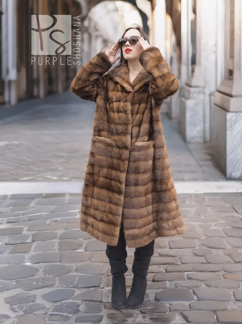 Beige pastel mink coat with shawl collar and horizontal stripe pattern, front view