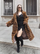 Beige pastel mink coat with shawl collar, horizontal stripe pattern, long sleeves, front open