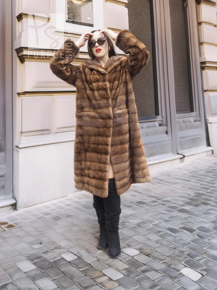 Beige pastel mink coat with shawl collar, horizontal stripes, side front view
