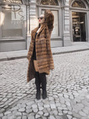 Beige pastel mink coat with shawl collar, horizontal stripes, long sleeves, mid-calf