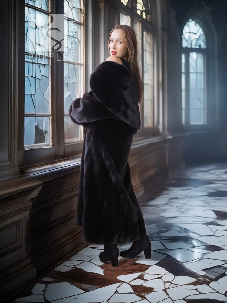 Black long hooded fur coat viewed from the side, open front with fur collar and full sleeves