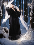 Black hooded long mink coat with silk lining, flowing open front and wide cuffs.